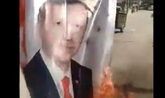 حرق صورة اردوغان