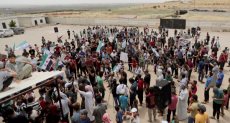 سوريون يتظاهرون على حدود تركيا