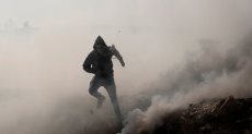فلسطيني وسط الدخان- أرشيفية
