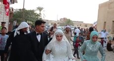 العروسان في لجنة مدرسة الخربة بشمال سيناء